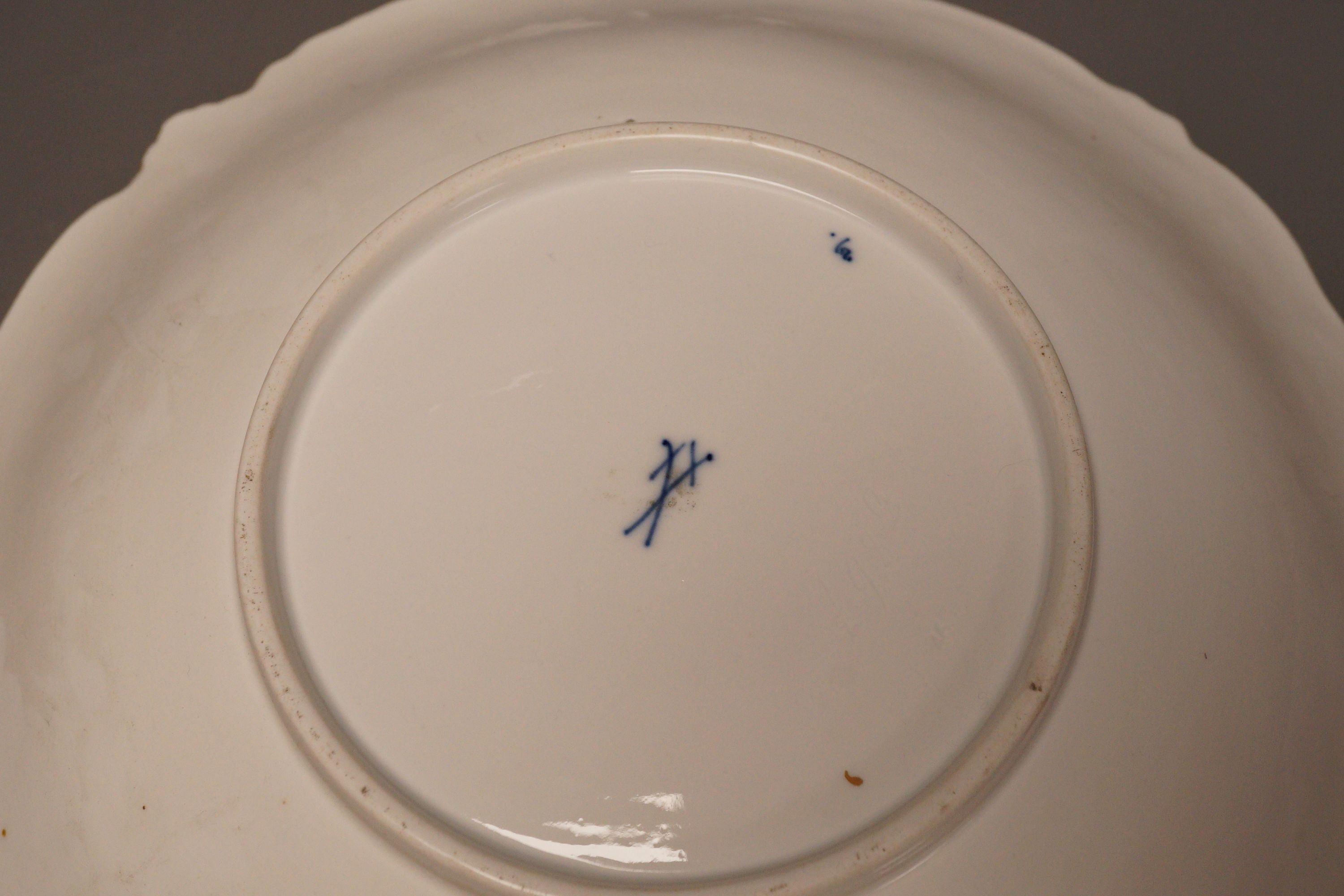 An early 20th century century Meissen fruit and floral gilt motif dish, 30cm diameter